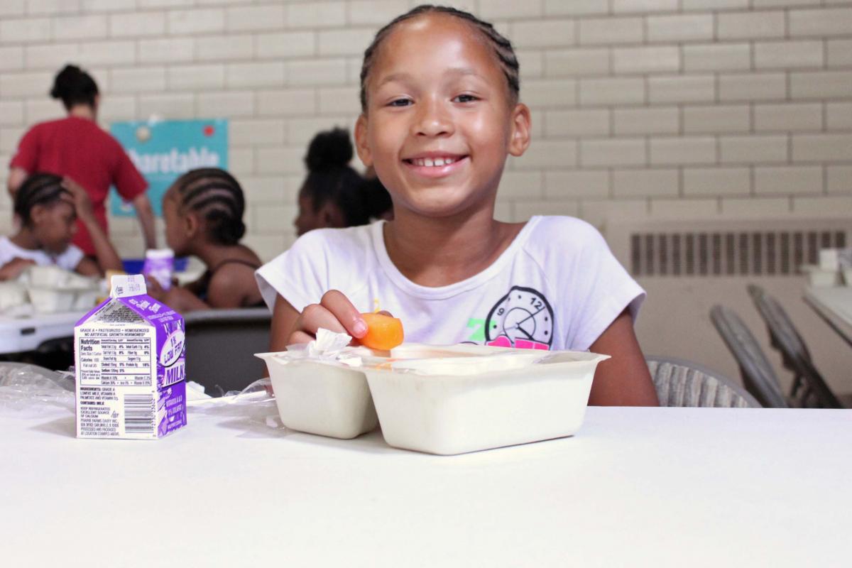 Smiling Girl Eating Lunch