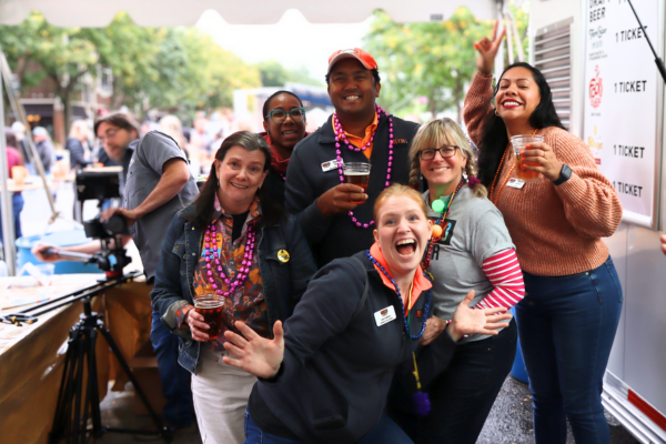 Group of volunteers smiling in beer tent