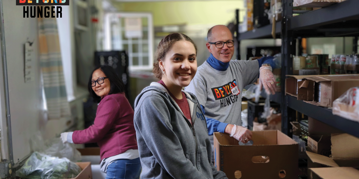 photo of three smiling volunteers