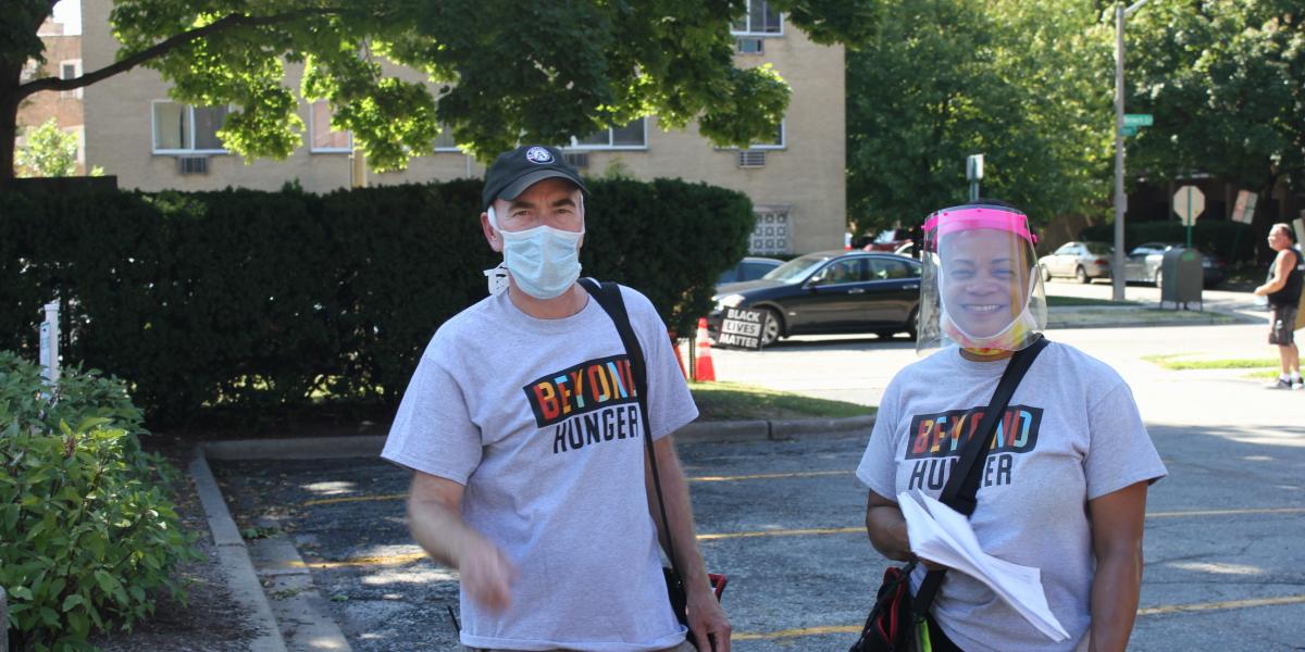 Two Beyond Hunger Volunteers in parking lot