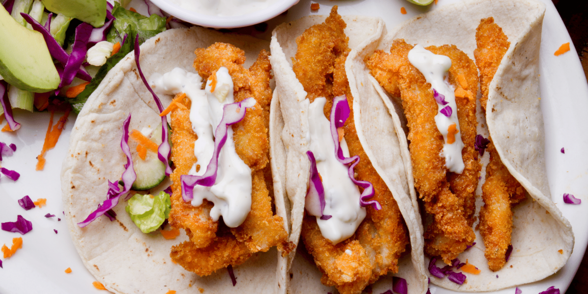breaded fish with tacos and cabbage