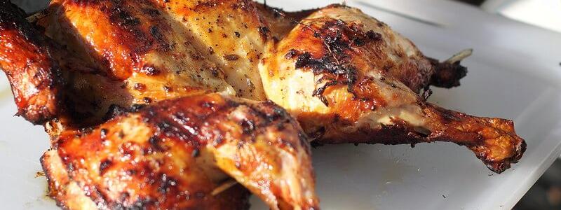 Spatchcock Chicken image on white plate - taken by photographer Mike McCune