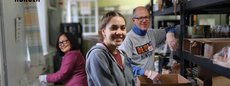 photo of three smiling volunteers