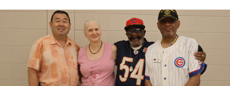 4 members of the Beyond Hunger Client Advisory Council standing side-by-side and smiling.