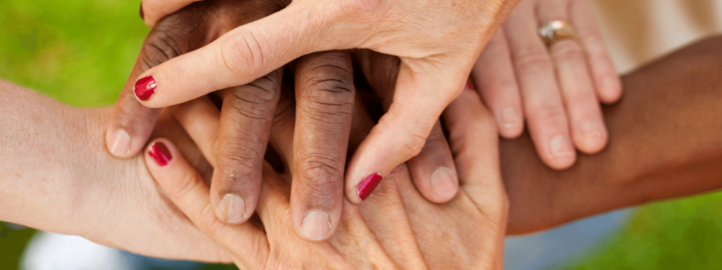 Hands grouped outside