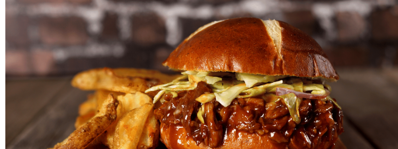 pulled pork on pretzel bun