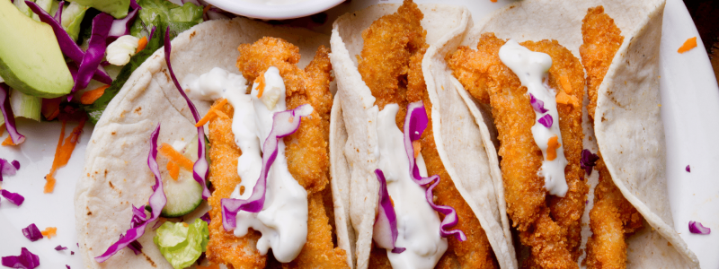 breaded fish with tacos and cabbage