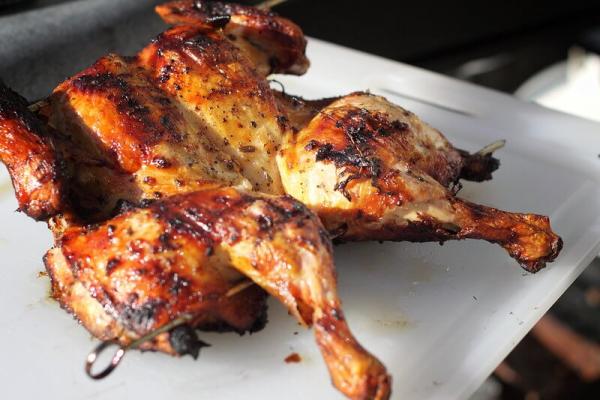 Spatchcock Chicken image on white plate - taken by photographer Mike McCune