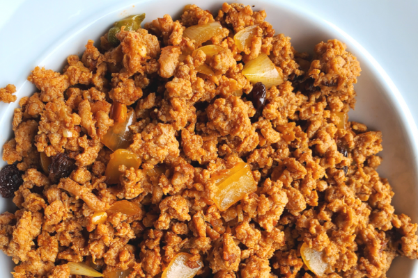Beef Picadillo Recipe Photo. Image of beef picadillo on a white plate, with a white background.