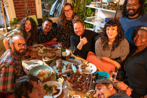 FRIENDS GATHERED AROUND A TABLE