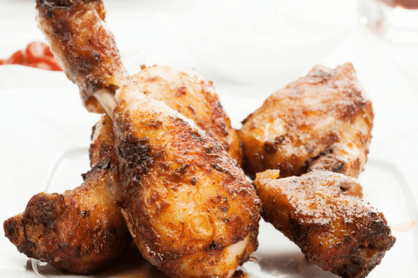 Apple Honey Chicken Drumsticks on white plate