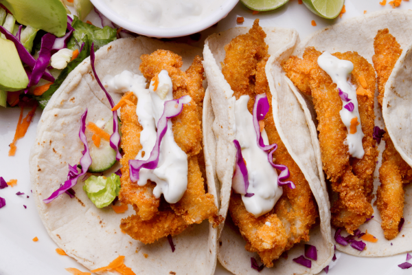 breaded fish with tacos and cabbage